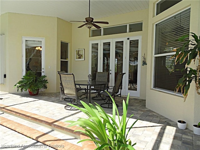view of patio / terrace featuring french doors, ceiling fan, and outdoor dining area