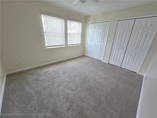 2713 Par Rd, Sebring, FL 33872 - unfurnished bedroom with two closets, carpet flooring, and ceiling fan