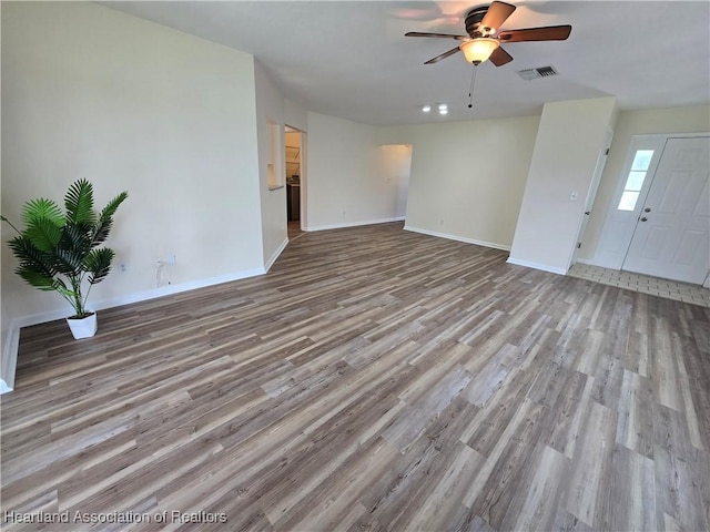 2713 Par Rd, Sebring, FL 33872 - unfurnished living room featuring wood finished floors and a ceiling fan