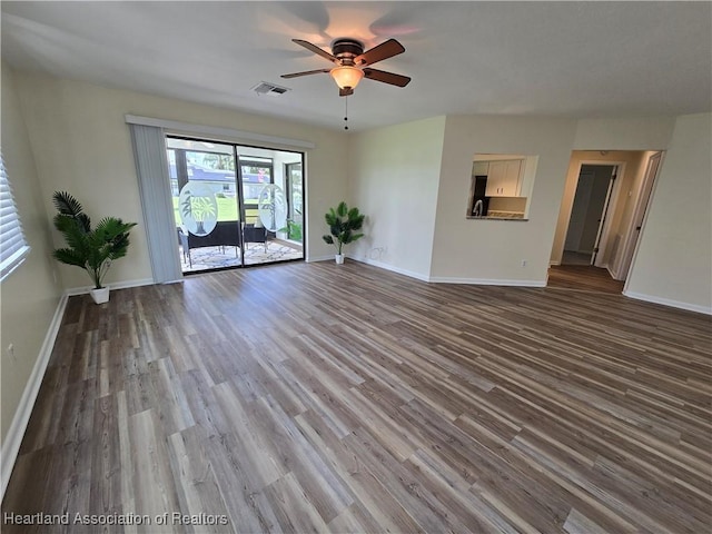2713 Par Rd, Sebring, FL 33872 - unfurnished living room with a ceiling fan and wood finished floors