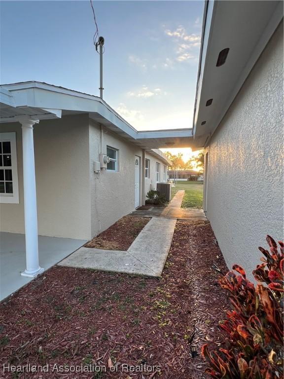 view of home's exterior with cooling unit