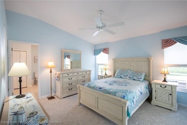 bedroom with light carpet, vaulted ceiling, and ceiling fan