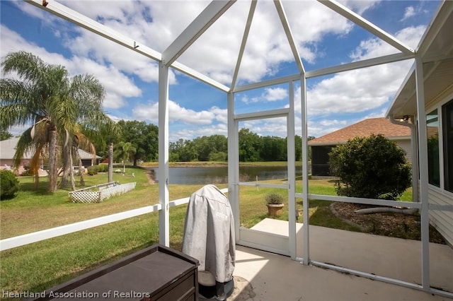 sunroom / solarium with a water view