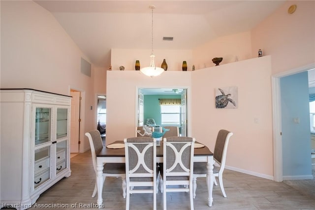 dining area with lofted ceiling