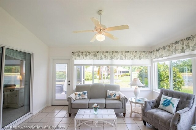 sunroom with ceiling fan and lofted ceiling