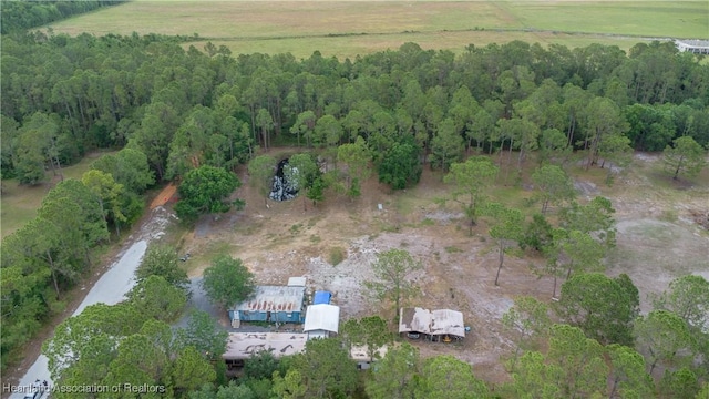 aerial view of property and surrounding area featuring rural landscape