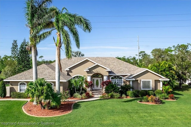 ranch-style home featuring a front yard