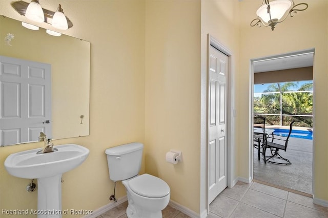 bathroom featuring tile patterned floors, sink, and toilet