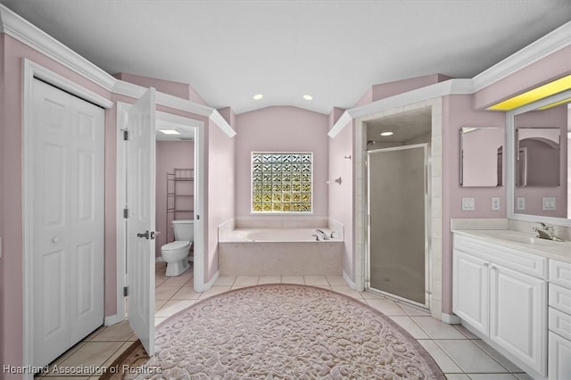 full bathroom featuring tile patterned flooring, independent shower and bath, toilet, and lofted ceiling