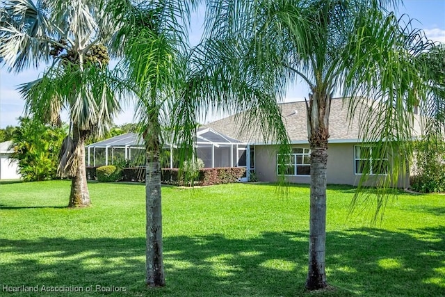 view of yard featuring a lanai