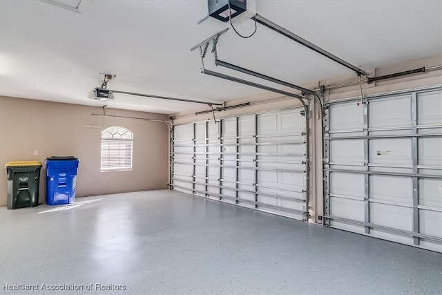 garage featuring a garage door opener