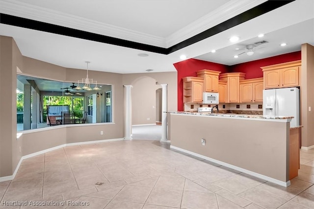 kitchen with white appliances, ceiling fan, ornamental molding, light brown cabinetry, and light stone counters