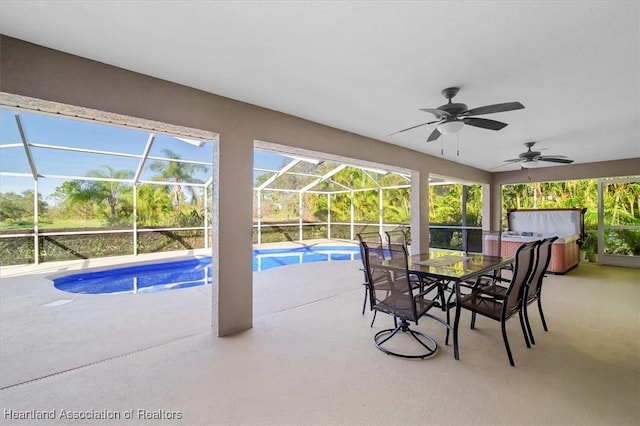 view of pool with a lanai, a patio area, and ceiling fan