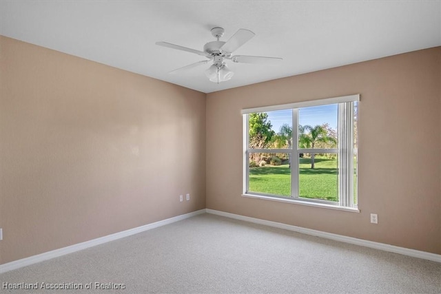 carpeted empty room with ceiling fan