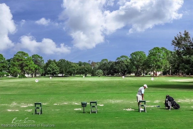 view of home's community featuring a lawn