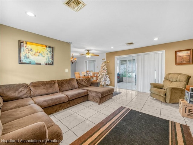 living area featuring recessed lighting, visible vents, and tile patterned floors