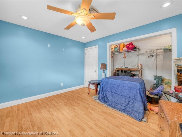 bedroom featuring a ceiling fan, recessed lighting, baseboards, and wood finished floors