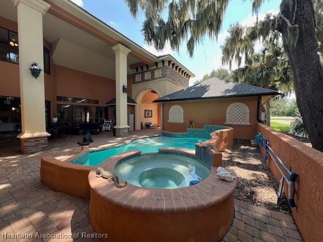 2230 Lake Ariana Blvd, Auburndale, FL 33823 - view of pool with a patio area and a pool with connected hot tub