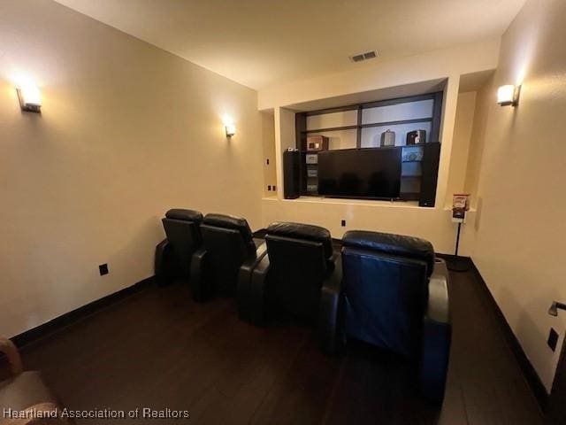 2230 Lake Ariana Blvd, Auburndale, FL 33823 - cinema with baseboards and wood finished floors