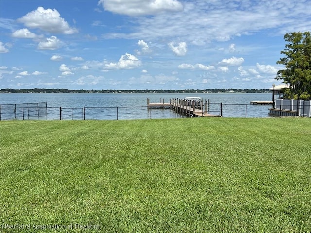2230 Lake Ariana Blvd, Auburndale, FL 33823 - dock area with a yard and a water view