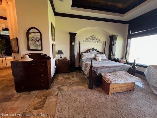 2230 Lake Ariana Blvd, Auburndale, FL 33823 - bedroom with crown molding and stone finish flooring