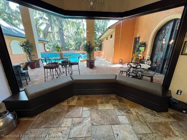 2230 Lake Ariana Blvd, Auburndale, FL 33823 - view of patio featuring outdoor dining space and an outdoor pool