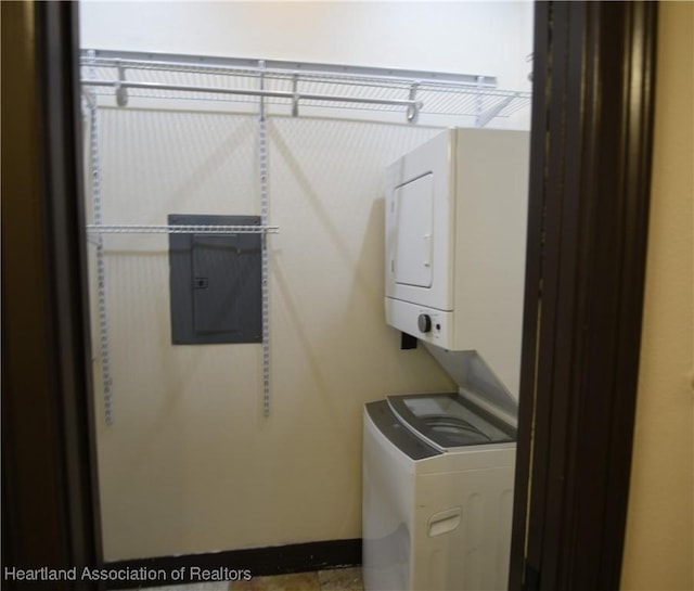 2230 Lake Ariana Blvd, Auburndale, FL 33823 - laundry area featuring stacked washing machine and dryer and electric panel
