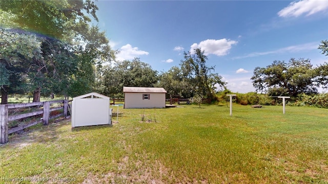 397 Maude Rd, Wauchula, FL 33873 - view of yard featuring a storage shed, an outbuilding, and fence