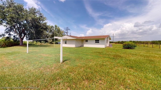 397 Maude Rd, Wauchula, FL 33873 - back of house featuring a lawn