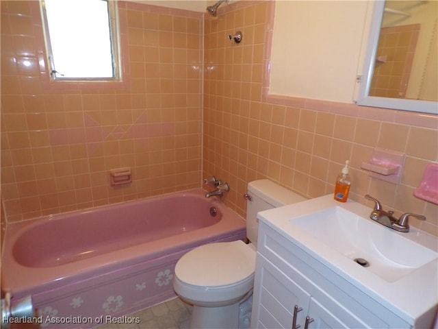 full bathroom featuring tasteful backsplash, toilet, vanity, tile walls, and tiled shower / bath