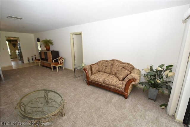 sitting room with light colored carpet