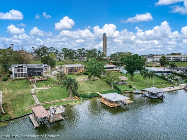 birds eye view of property with a water view
