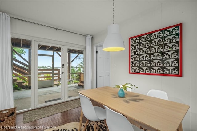 dining room with dark wood-type flooring and french doors