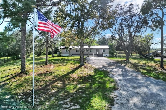 119 Mini Rd, Sebring, FL 33870 - view of front of property featuring asphalt driveway and a front yard