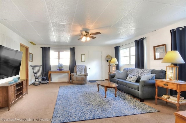 119 Mini Rd, Sebring, FL 33870 - living area with carpet floors, a paneled ceiling, and a ceiling fan