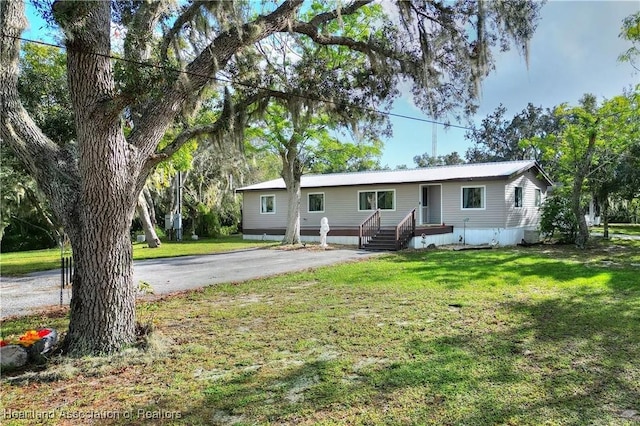 119 Mini Rd, Sebring, FL 33870 - ranch-style house with a front yard