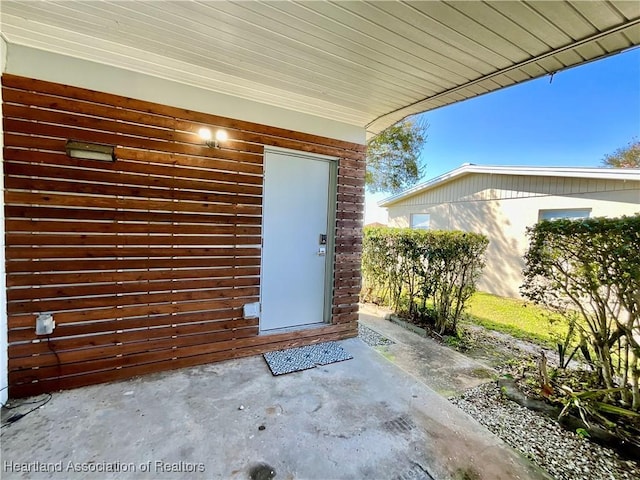 510 Lake June Rd, Lake Placid, FL 33852 - view of exterior entry with a patio