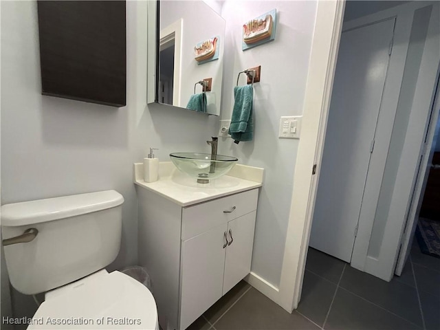510 Lake June Rd, Lake Placid, FL 33852 - bathroom featuring tile patterned floors, vanity, and toilet