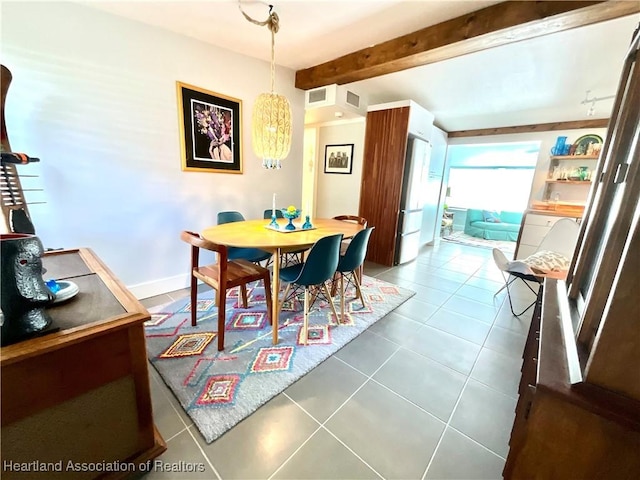 tiled dining area with beamed ceiling