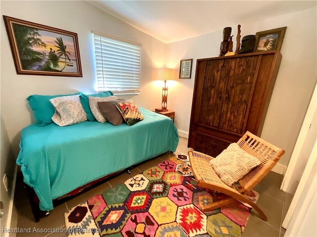 510 Lake June Rd, Lake Placid, FL 33852 - bedroom with dark tile patterned floors and lofted ceiling