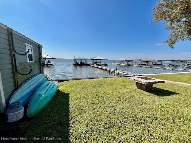 510 Lake June Rd, Lake Placid, FL 33852 - view of dock featuring a water view, a yard, and an outdoor fire pit