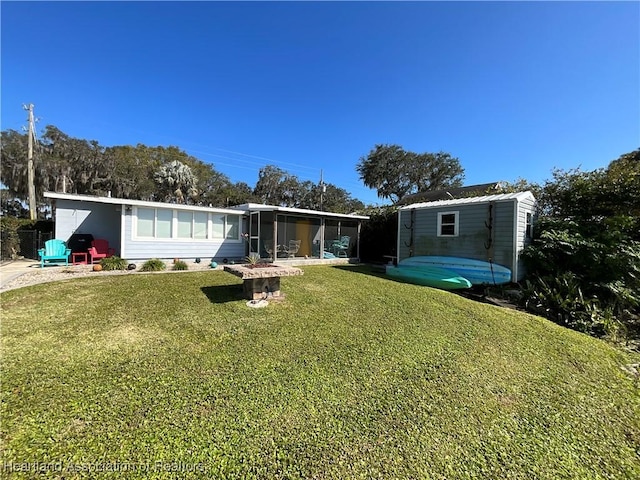 510 Lake June Rd, Lake Placid, FL 33852 - back of house featuring a yard and a sunroom