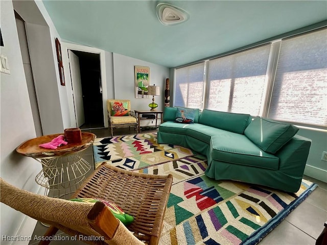 510 Lake June Rd, Lake Placid, FL 33852 - tiled living room featuring vaulted ceiling