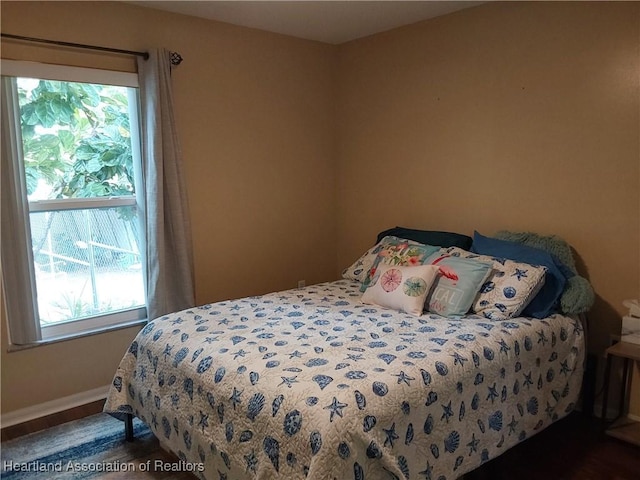 bedroom featuring baseboards