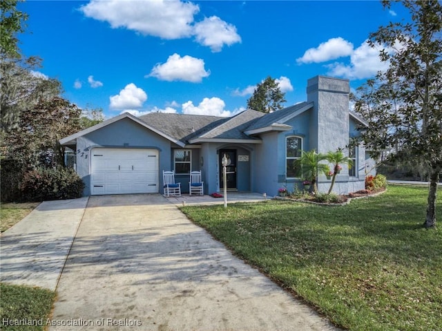 ranch-style house with a garage and a front lawn