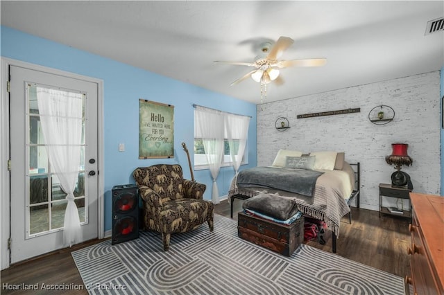 bedroom with dark wood-type flooring and ceiling fan