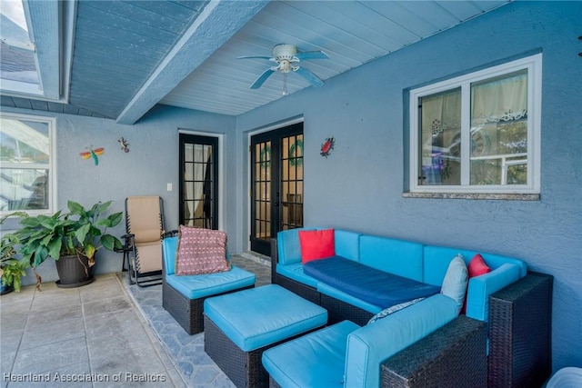 view of patio / terrace featuring french doors, ceiling fan, and outdoor lounge area