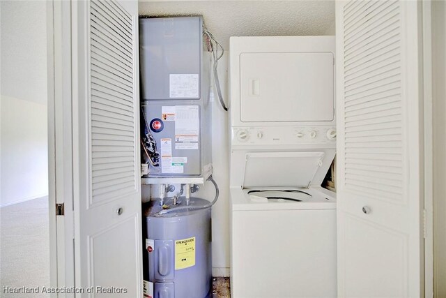 5544 Matanzas Dr, Sebring, FL 33872 - laundry area featuring stacked washer / dryer and electric water heater