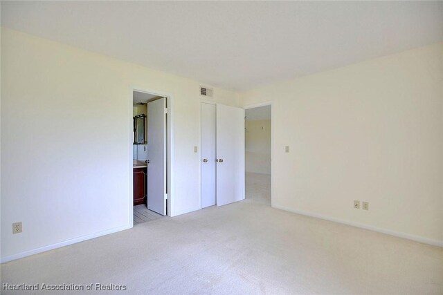 5544 Matanzas Dr, Sebring, FL 33872 - empty room featuring light carpet and baseboards