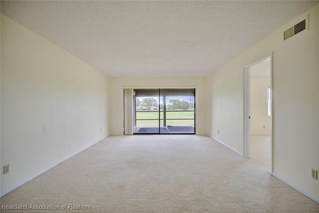 5544 Matanzas Dr, Sebring, FL 33872 - unfurnished room featuring carpet, a textured ceiling, and baseboards